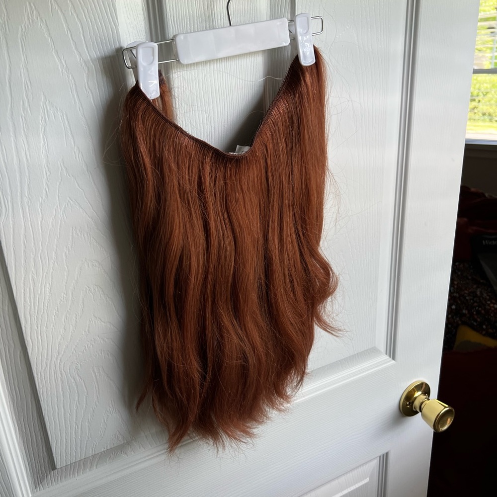 Hidden Crown halo hair extensions in light auburn.